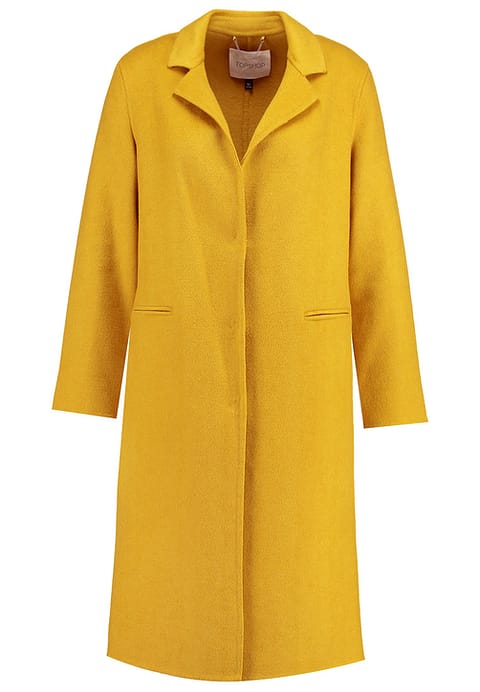Moda curvy: meglio il cappotto o il piumino? 4 cappotto classico per donna formosa