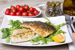 Branzino al forno: la ricetta dei filetti con le patate