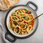 Calamari con piselli: un secondo nutriente 1 calamari con piselli: ricetta